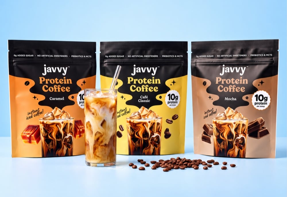 Javvy Protein Coffee bags in Caramel, Café Classic and Mocha next to an iced coffee.