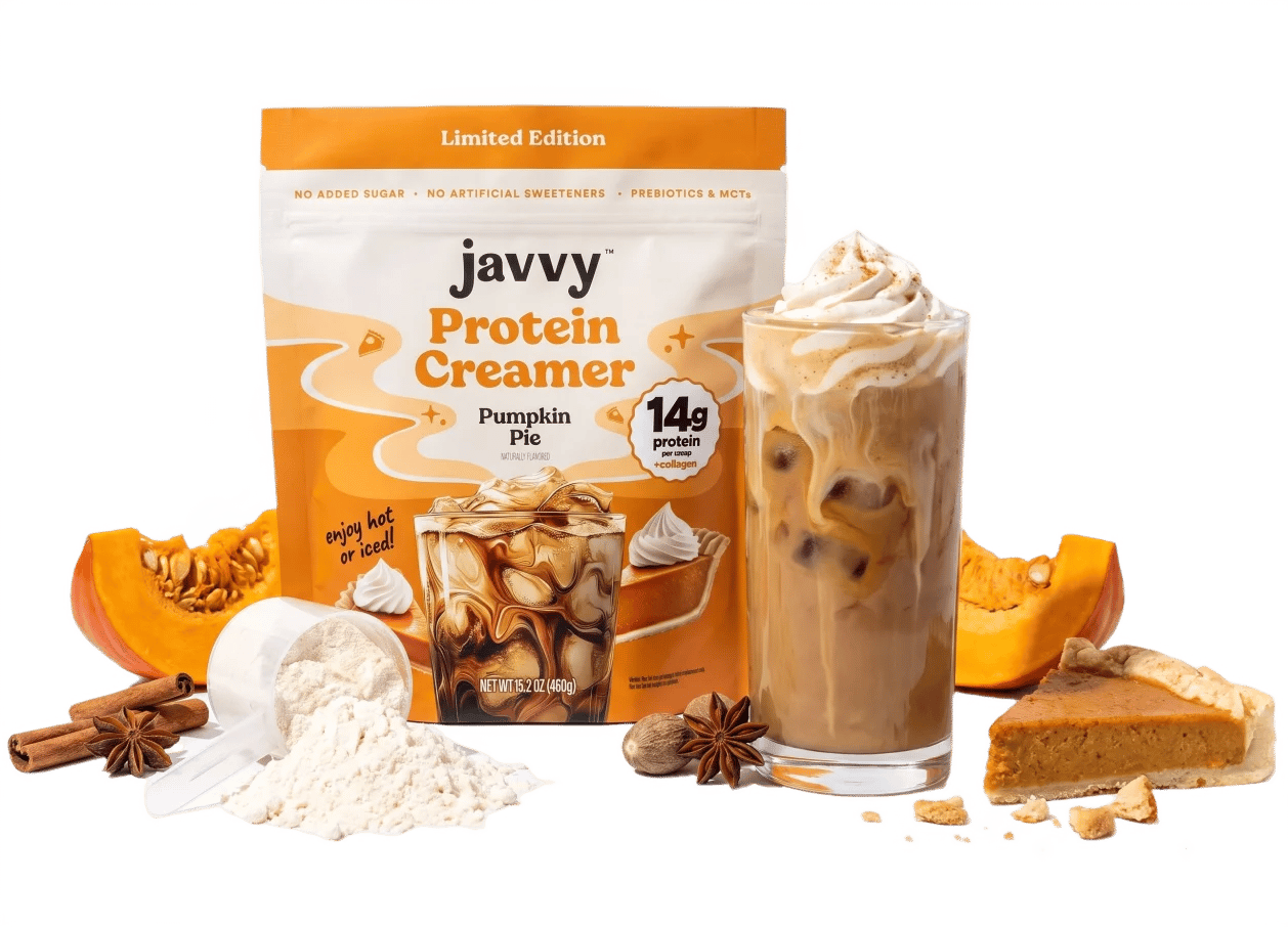 Javvy Protein Creamer bag and iced latte next to protein powder, pumpkin, spices and pumpkin pie