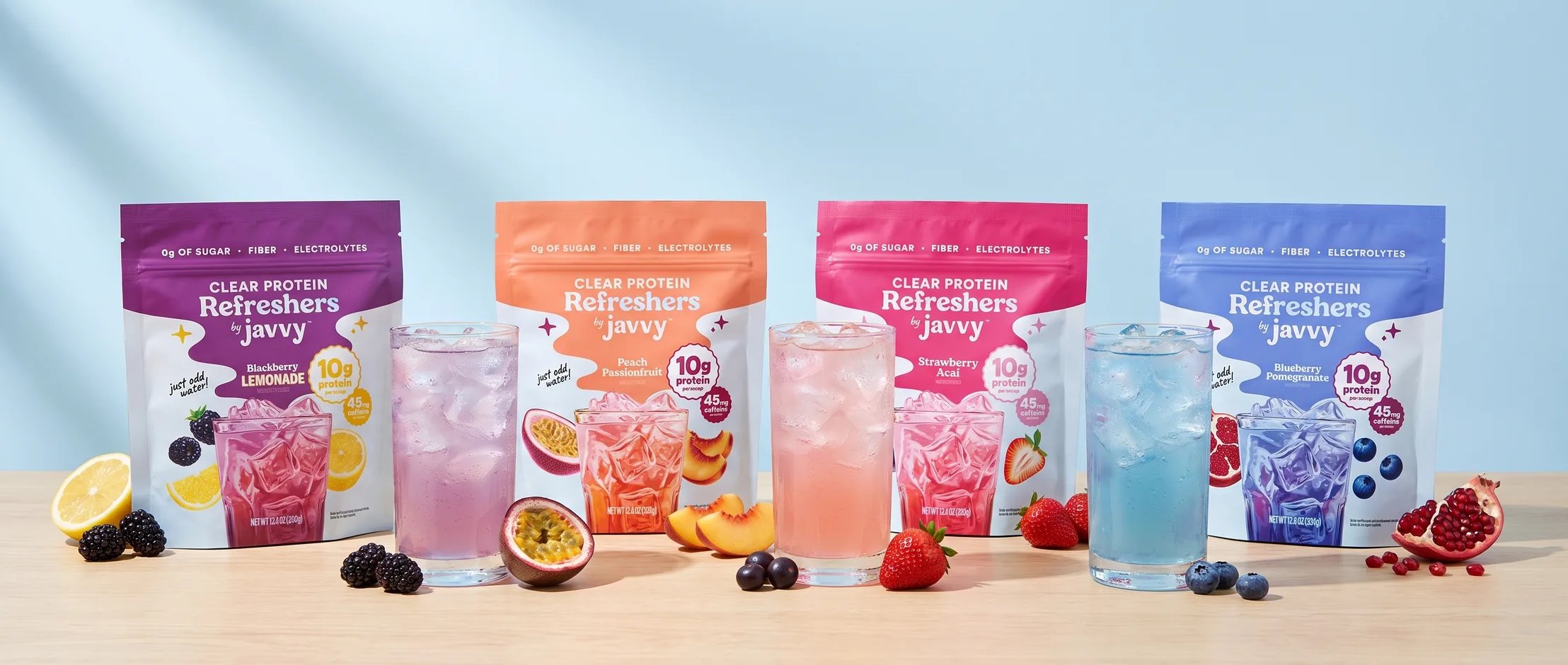 Four Javvy Protein Refresher flavors with iced drinks and fruit