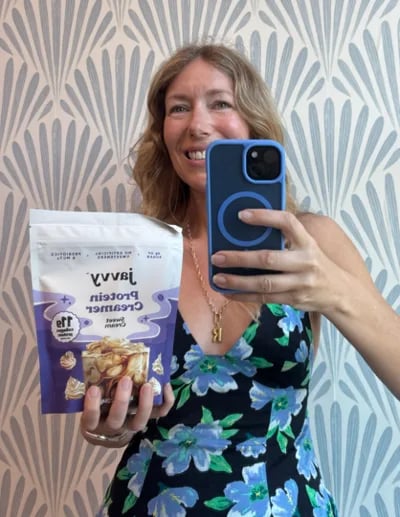 Customer taking a mirror selfie with a bag of Javvy Protein Creamer