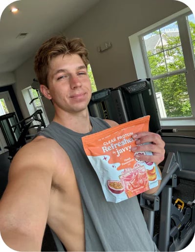 Customer at the gym with a bag of Javvy Protein Refreshers