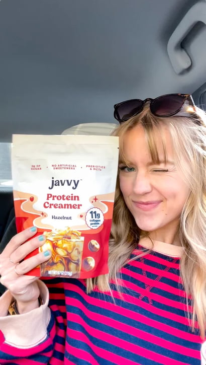 Customer holding a bag of Javvy Protein Creamer