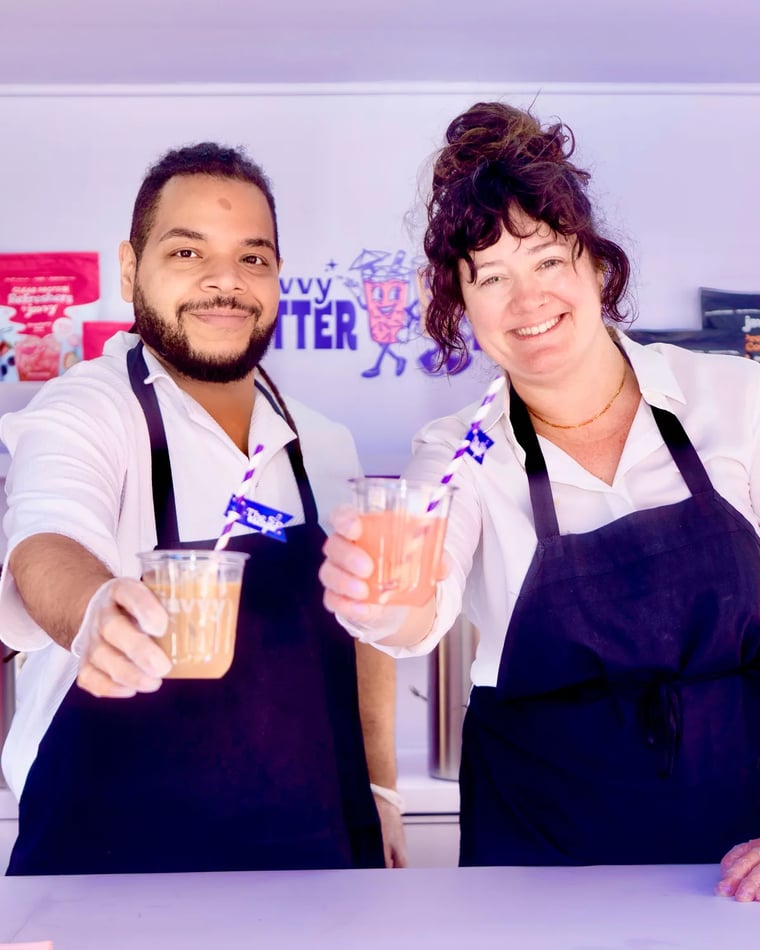 Javvy baristas handing over iced drinks